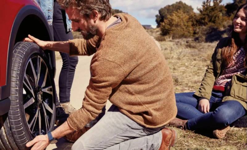 Man changing a car tire
